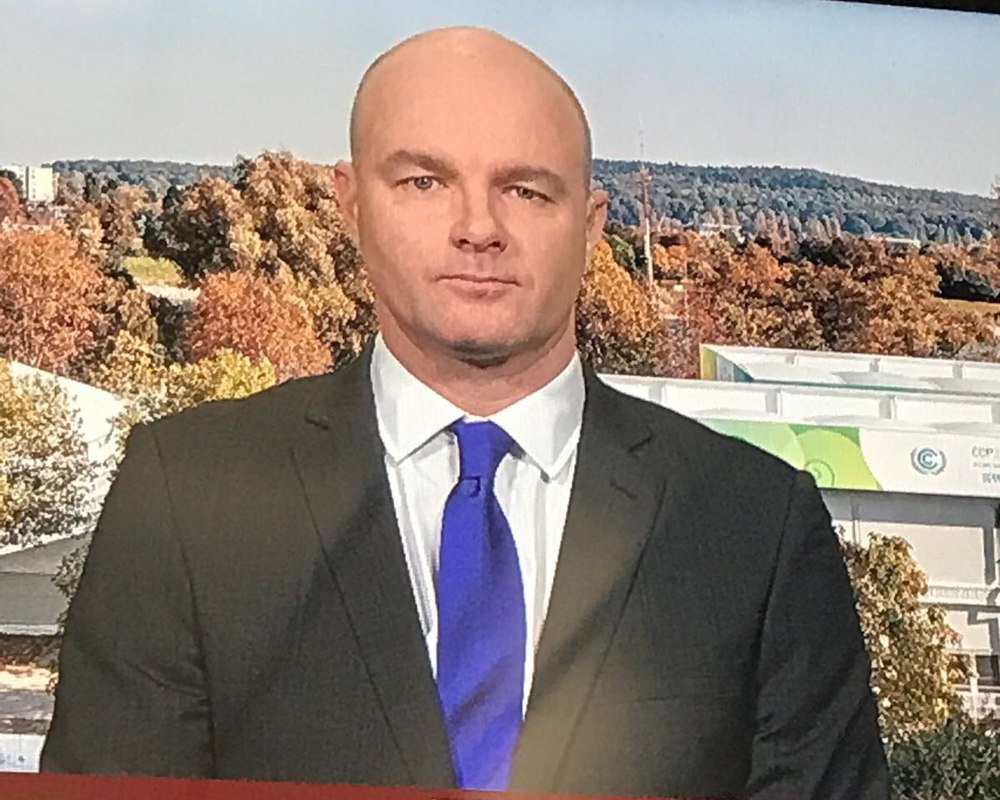 Benjamin Sporton on a broadcast camera feed at a UN climate conference, moments before going live